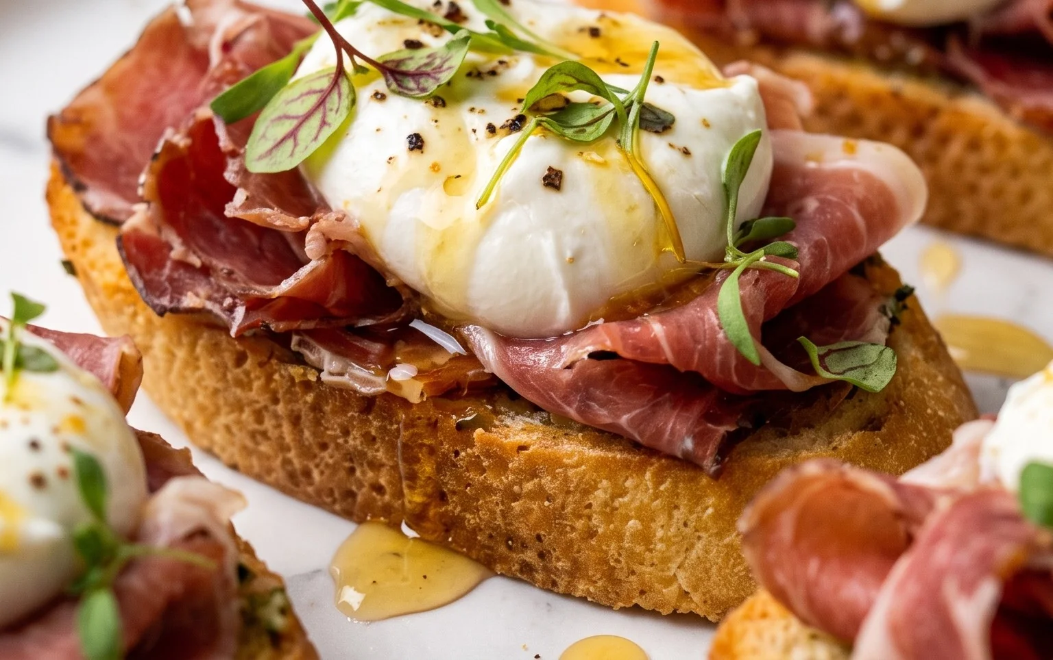 Beef Prosciutto Crostini with Burrata and Lemon Honey Drizzle
